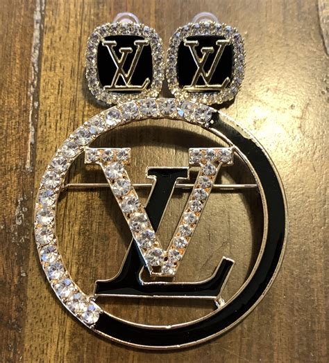 louis vuitton brooch.